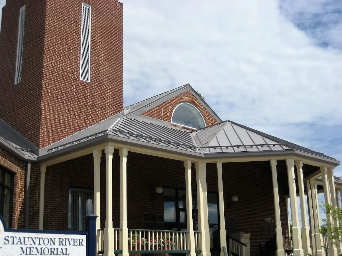 Skilled roofing craftsmen working on a residential roof in Kenner